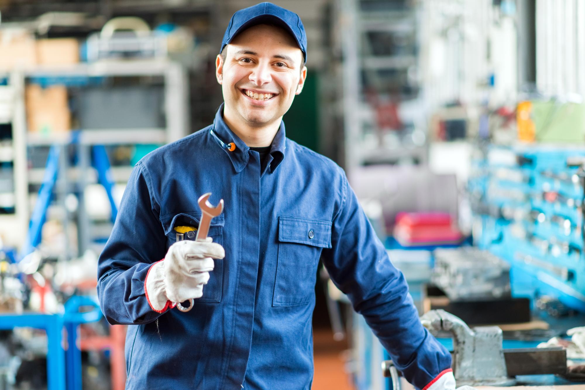 mechanic holding wrench